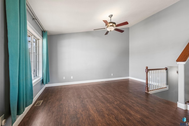 unfurnished living room featuring baseboards, wood finished floors, and a ceiling fan