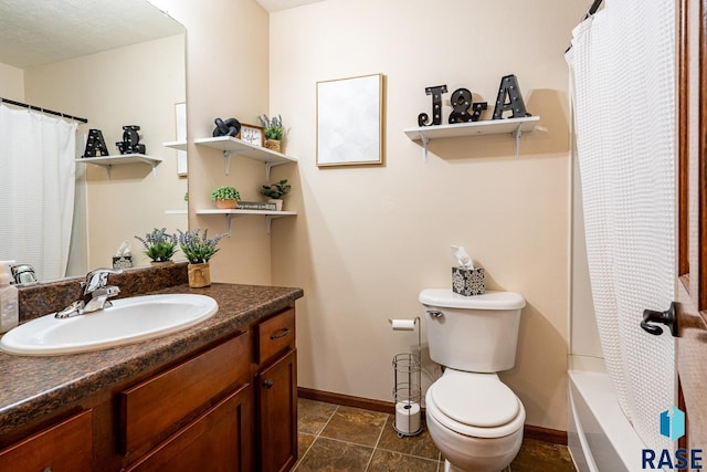 full bathroom featuring vanity, toilet, baseboards, and tile patterned flooring