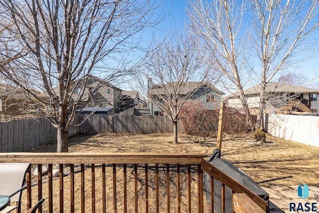 view of yard featuring a residential view and a fenced backyard