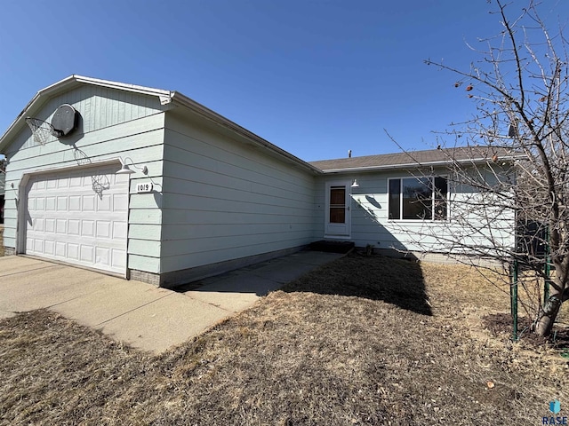 view of side of home with an attached garage