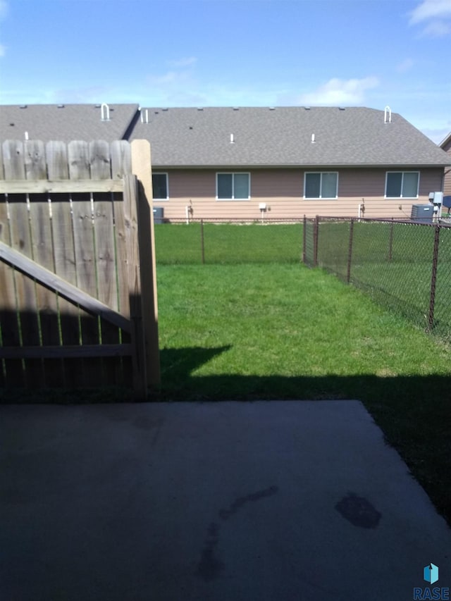 view of yard with a fenced backyard