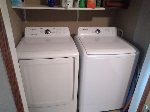 washroom featuring independent washer and dryer and laundry area