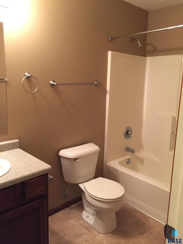 full bathroom with baseboards, toilet, shower / tub combination, tile patterned floors, and vanity