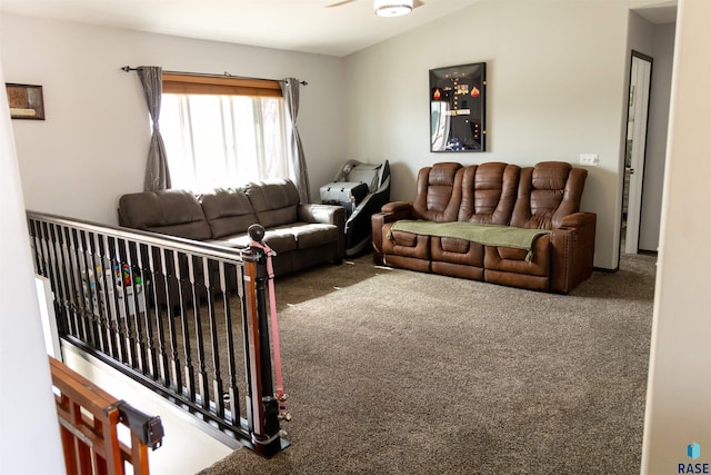 carpeted living room with lofted ceiling