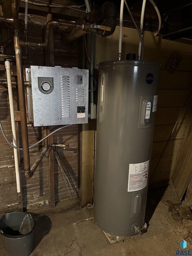 utility room featuring water heater