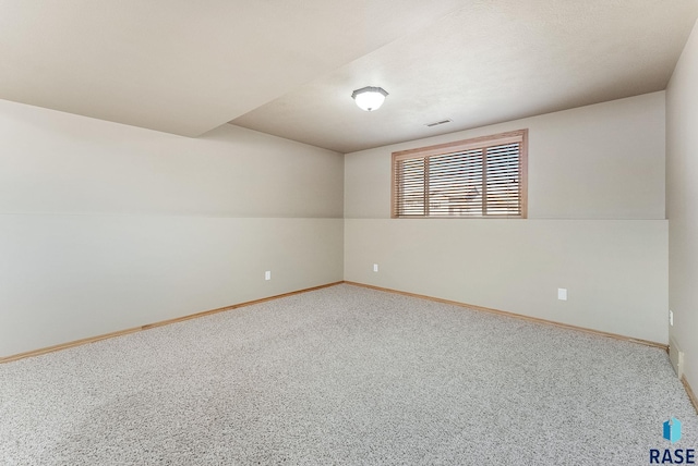 carpeted empty room with baseboards