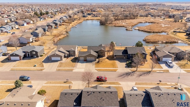 bird's eye view featuring a residential view and a water view