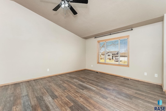 empty room featuring baseboards, wood finished floors, lofted ceiling, and ceiling fan