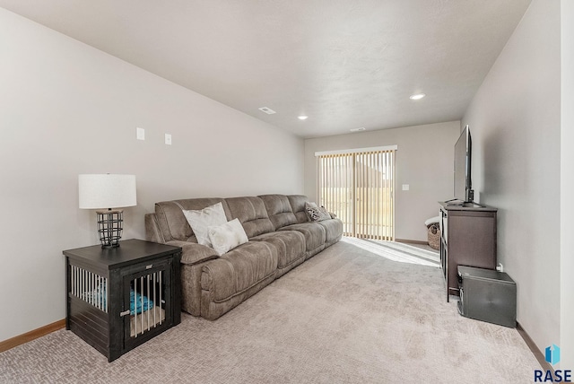 carpeted living room with recessed lighting, visible vents, and baseboards