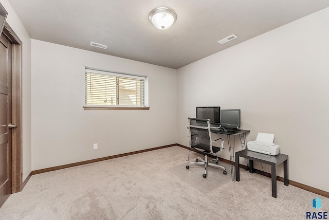 office area featuring visible vents, carpet floors, and baseboards