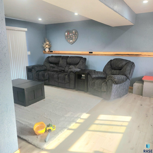living room with recessed lighting and wood finished floors