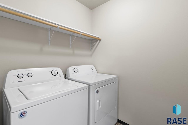 washroom with washing machine and dryer and laundry area