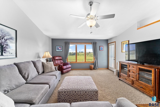 living room with light colored carpet, baseboards, and a ceiling fan