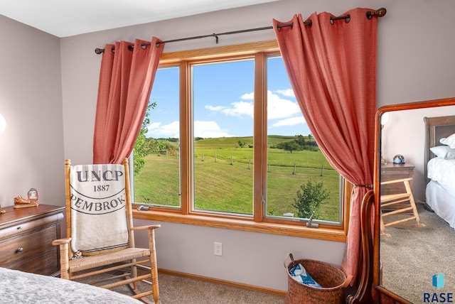 bedroom with carpet flooring and baseboards