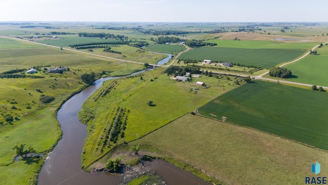 drone / aerial view with a rural view and a water view