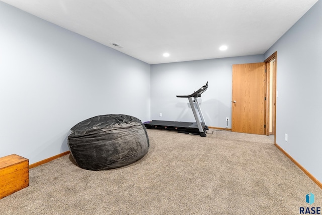 exercise room featuring recessed lighting, baseboards, and carpet