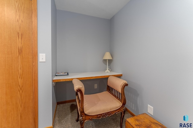office space with carpet flooring, built in study area, and baseboards