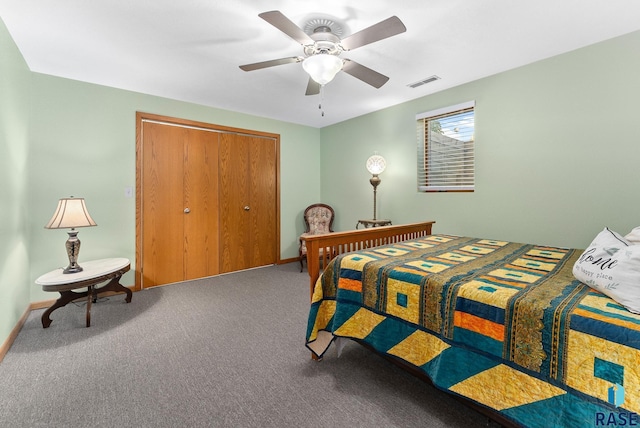 bedroom with baseboards, visible vents, carpet floors, ceiling fan, and a closet