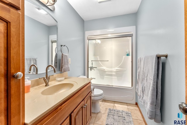 full bathroom featuring tile patterned floors, enclosed tub / shower combo, toilet, and vanity