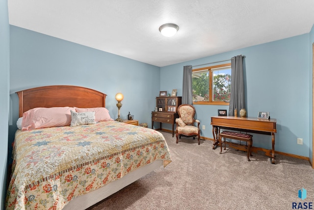 bedroom featuring carpet flooring and baseboards