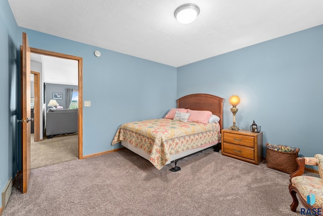 bedroom with carpet flooring and baseboards
