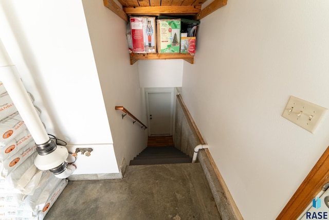 stairs featuring concrete floors