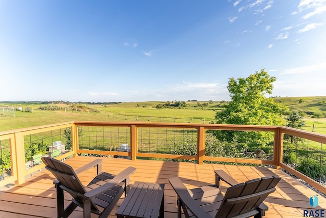 wooden deck featuring a rural view
