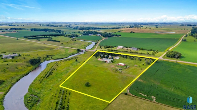 birds eye view of property featuring a rural view and a water view