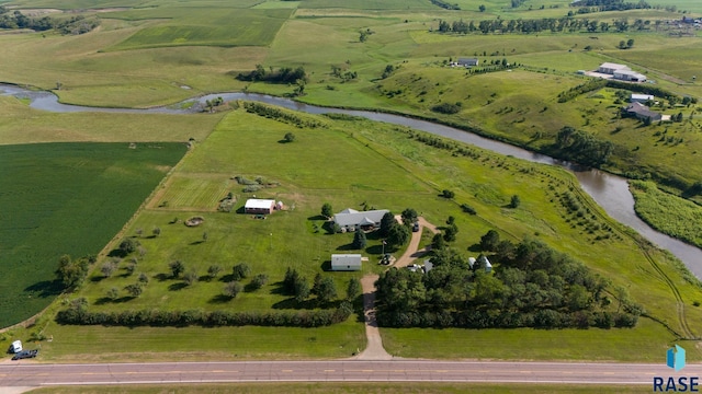 aerial view with a water view and a rural view