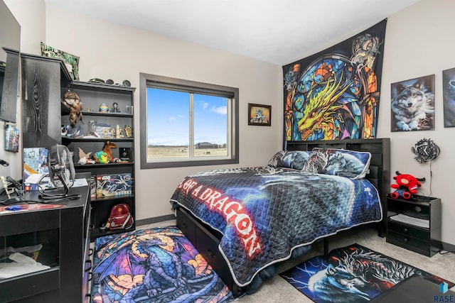 carpeted bedroom with baseboards