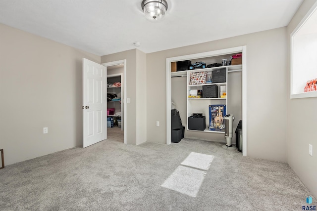 carpeted bedroom with a closet