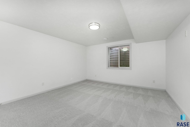 204 E 81st Pl, Sioux Falls, SD 57108 - unfurnished room featuring baseboards, light colored carpet, and a textured ceiling