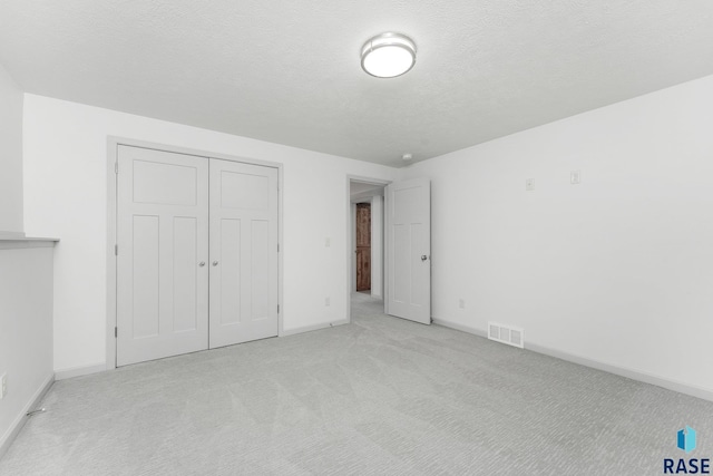 204 E 81st Pl, Sioux Falls, SD 57108 - unfurnished bedroom featuring visible vents, carpet flooring, a textured ceiling, and baseboards