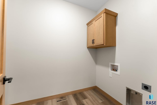 laundry area featuring washer hookup, light wood-style flooring, cabinet space, baseboards, and hookup for an electric dryer