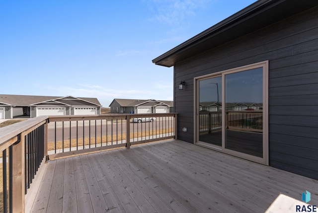 wooden terrace featuring a residential view