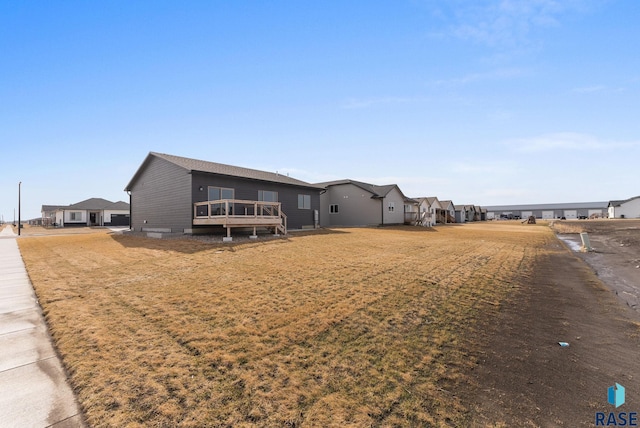 exterior space with a lawn and a deck