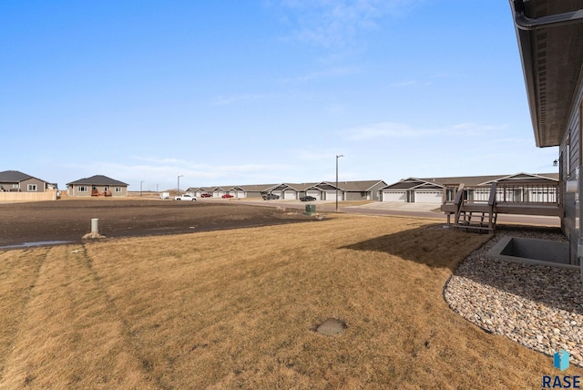 view of yard featuring a residential view