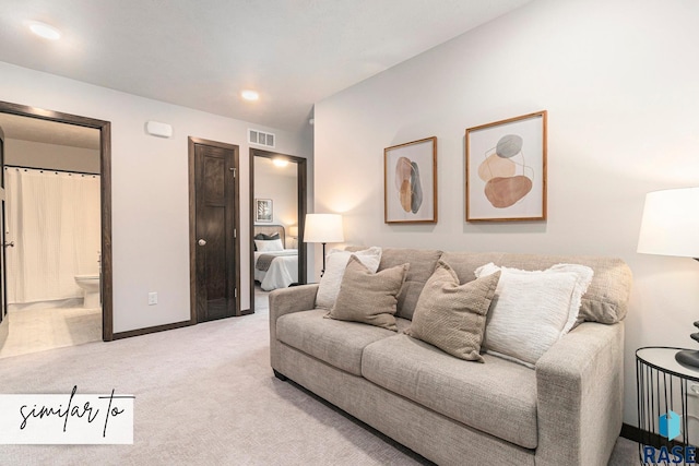 5714 E Avett Pl, Sioux Falls, SD 57108 - carpeted living area featuring visible vents and baseboards