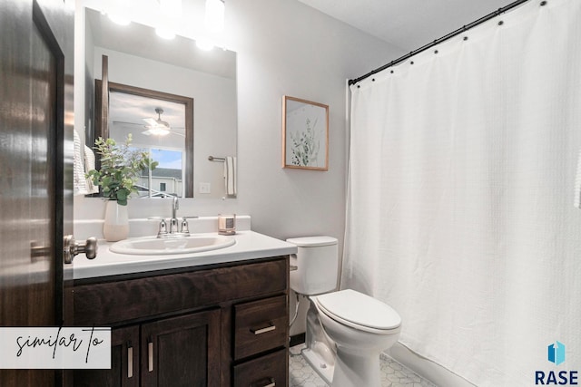 5714 E Avett Pl, Sioux Falls, SD 57108 - bathroom with a shower with shower curtain, toilet, vanity, and a ceiling fan