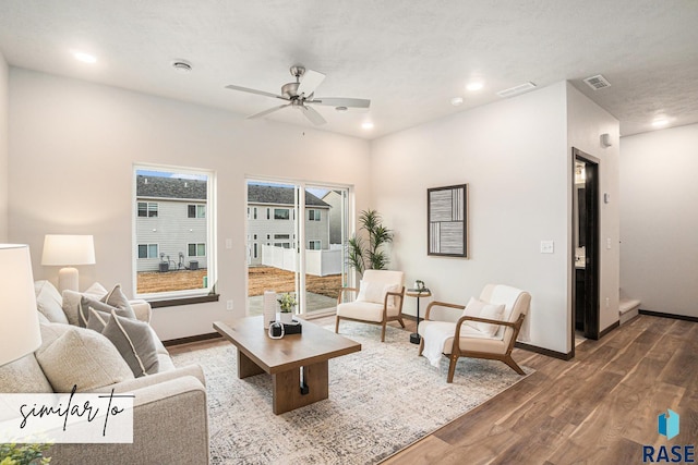 5714 E Avett Pl, Sioux Falls, SD 57108 - living area with a ceiling fan, wood finished floors, visible vents, and baseboards