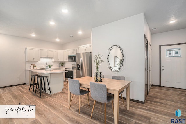 5714 E Avett Pl, Sioux Falls, SD 57108 - dining space featuring recessed lighting, wood finished floors, and baseboards