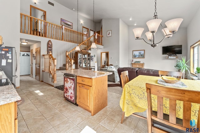 6305 Lakeview Dr, Wentworth, SD 57075 - kitchen featuring visible vents, decorative light fixtures, open floor plan, freestanding refrigerator, and an inviting chandelier