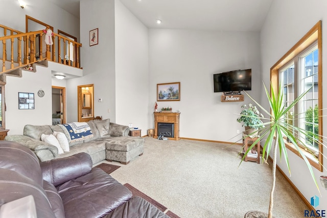 6305 Lakeview Dr, Wentworth, SD 57075 - living room with stairway, a high ceiling, carpet, and baseboards