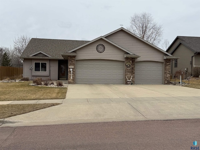 800 W Sterling Oak Cir, Sioux Falls, SD 57108 - single story home featuring a garage, brick siding, concrete driveway, and fence