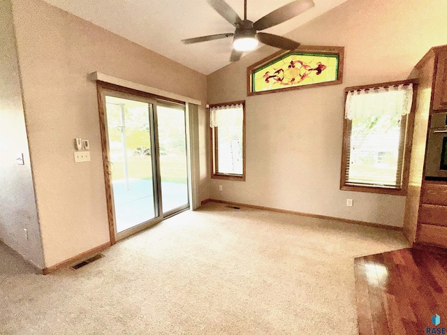 800 W Sterling Oak Cir, Sioux Falls, SD 57108 - spare room featuring ceiling fan, vaulted ceiling, and light carpet