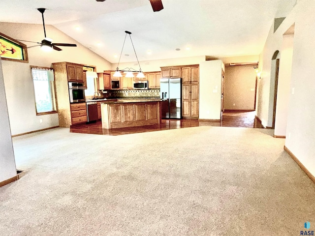 800 W Sterling Oak Cir, Sioux Falls, SD 57108 - kitchen with appliances with stainless steel finishes, ceiling fan, open floor plan, tasteful backsplash, and dark colored carpet
