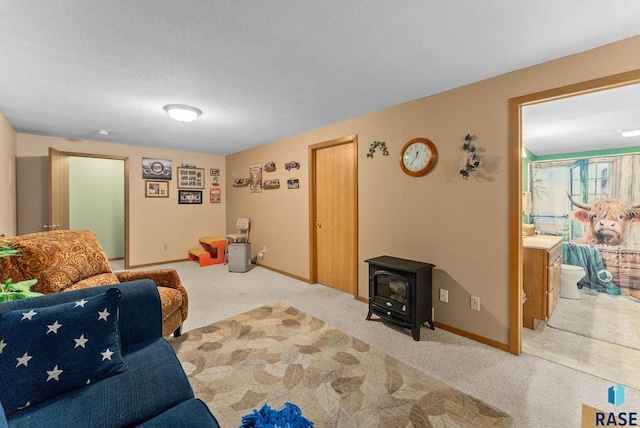 living room with carpet flooring, a wood stove, and baseboards