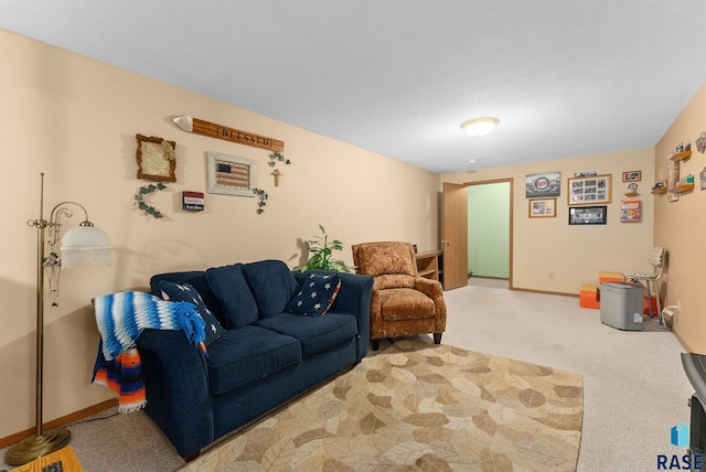carpeted living room featuring baseboards