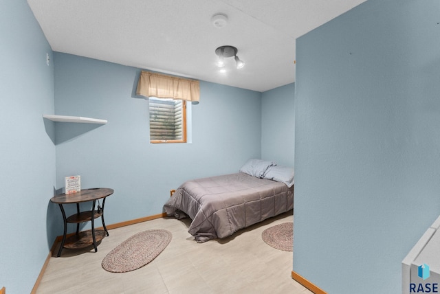 bedroom featuring baseboards