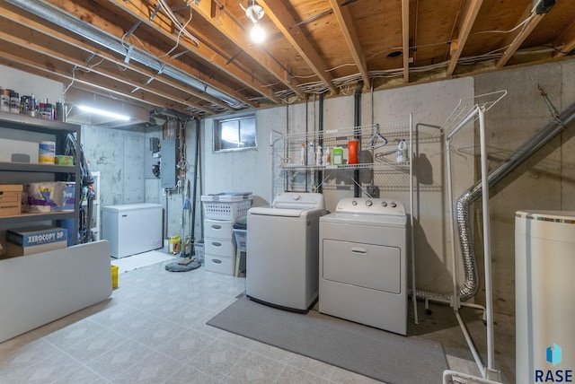 below grade area with fridge, washing machine and dryer, and tile patterned floors